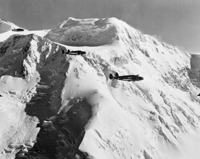 Postcard U.S. A-29S Flying Over THE Mountains Alaska